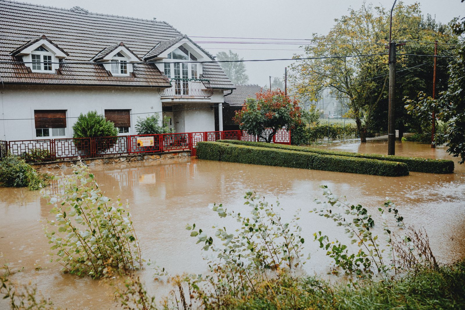 A suburban home surrounded by floodwater after heavy rain