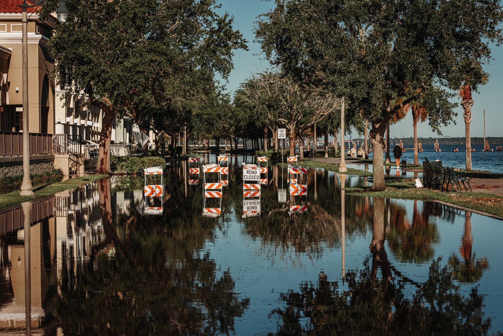 Flooded street with road closed signs during a flood emergency