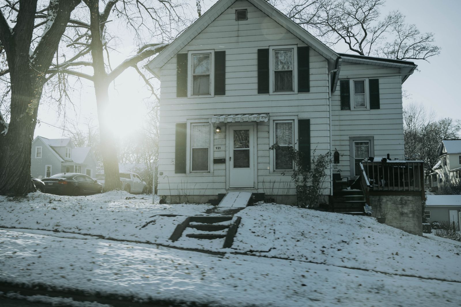 A two-story house in Dixon, Illinois on a snow-covered street after fresh winter snow